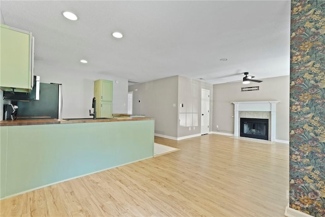 7305 Leghorn St, Savannah, GA 31406 - unfurnished living room with ceiling fan, light wood-type flooring, a fireplace with flush hearth, and recessed lighting