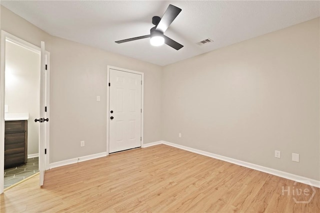 7305 Leghorn St, Savannah, GA 31406 - unfurnished room featuring light wood-style floors and a ceiling fan
