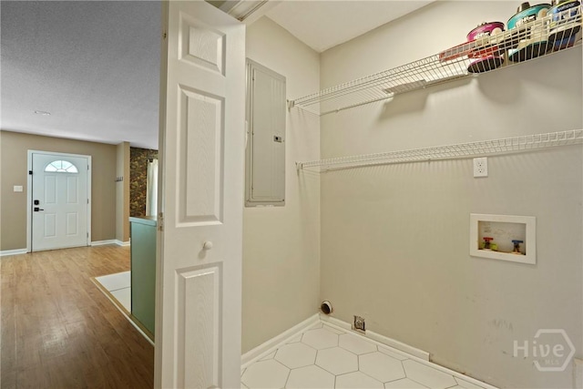 7305 Leghorn St, Savannah, GA 31406 - laundry room with electric panel, washer hookup, and wood finished floors
