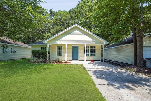 7305 Leghorn St, Savannah, GA 31406 - ranch-style home featuring covered porch, a front lawn, and concrete driveway