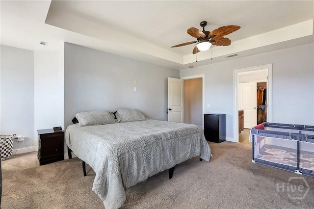 243 Forest St NE, Ludowici, GA 31316 - bedroom with a tray ceiling, light colored carpet, and a ceiling fan