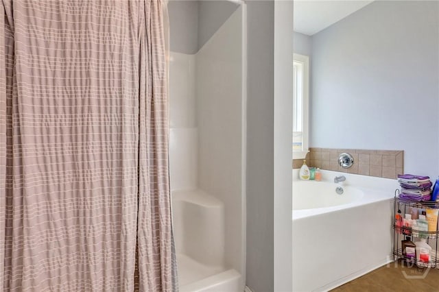 243 Forest St NE, Ludowici, GA 31316 - bathroom with a garden tub and curtained shower