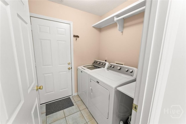 178 Junco Way, Savannah, GA 31419 - laundry room with washer and clothes dryer and light tile patterned floors
