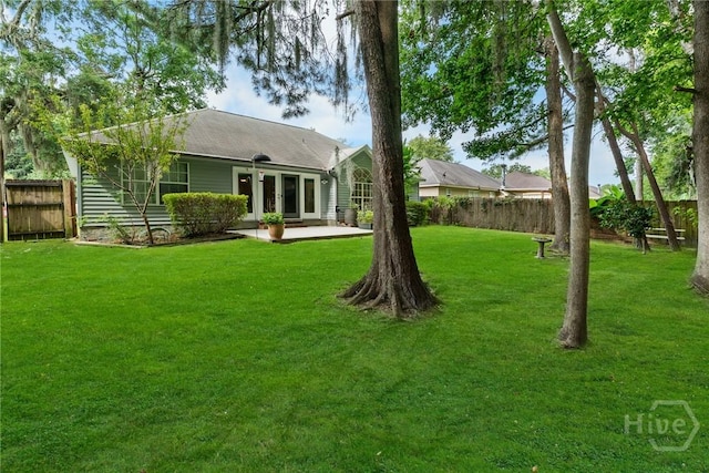 178 Junco Way, Savannah, GA 31419 - rear view of house featuring a fenced backyard, a patio area, and french doors