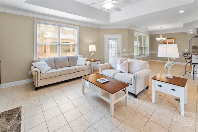 903 River Oaks Dr Unit 903, Richmond Hill, GA 31324 - living area featuring light tile patterned floors, a ceiling fan, a chandelier, a raised ceiling, and ornamental molding