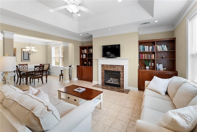 903 River Oaks Dr Unit 903, Richmond Hill, GA 31324 - living area with a tray ceiling, a ceiling fan, a chandelier, a premium fireplace, and recessed lighting
