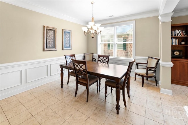 903 River Oaks Dr Unit 903, Richmond Hill, GA 31324 - dining area featuring crown molding, a chandelier, ornate columns, light tile patterned flooring, and a wainscoted wall
