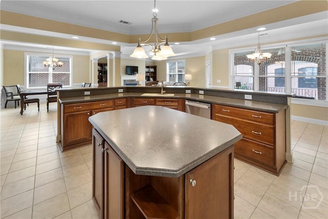 903 River Oaks Dr Unit 903, Richmond Hill, GA 31324 - kitchen with a chandelier, a large island, ornamental molding, stainless steel dishwasher, and brown cabinetry
