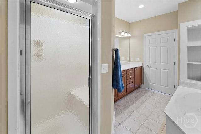 903 River Oaks Dr Unit 903, Richmond Hill, GA 31324 - full bath featuring vanity, a shower stall, a garden tub, and tile patterned flooring