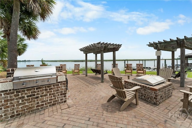 903 River Oaks Dr Unit 903, Richmond Hill, GA 31324 - view of patio with an outdoor kitchen, a pergola, and a water view