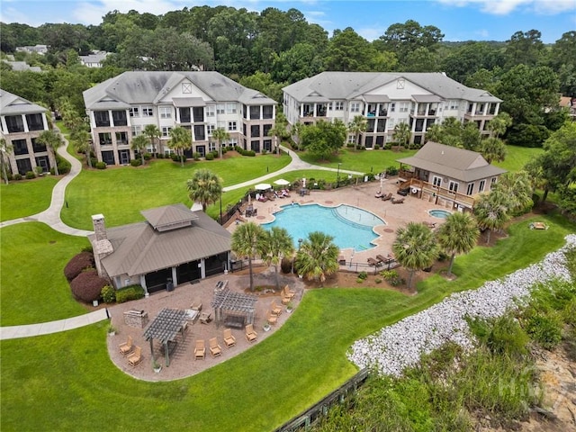 903 River Oaks Dr Unit 903, Richmond Hill, GA 31324 - aerial view of a pool area and a tree filled landscape