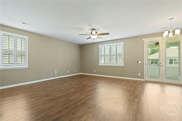 7 Saddle St N, Savannah, GA 31407 - spare room with wood finished floors, a ceiling fan, a chandelier, and french doors