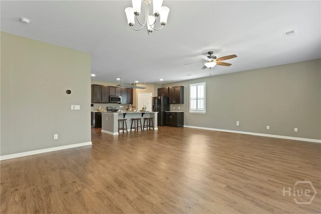 7 Saddle St N, Savannah, GA 31407 - living area featuring wood finished floors, a chandelier, ceiling fan, and recessed lighting