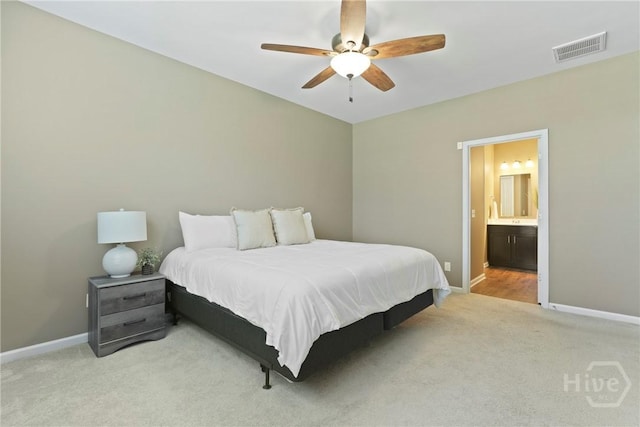 7 Saddle St N, Savannah, GA 31407 - carpeted bedroom with ensuite bath and a ceiling fan