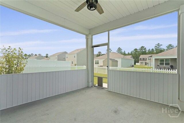 7 Saddle St N, Savannah, GA 31407 - unfurnished sunroom with a ceiling fan and a residential view