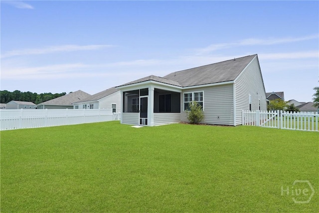 7 Saddle St N, Savannah, GA 31407 - rear view of house with a sunroom and a fenced backyard