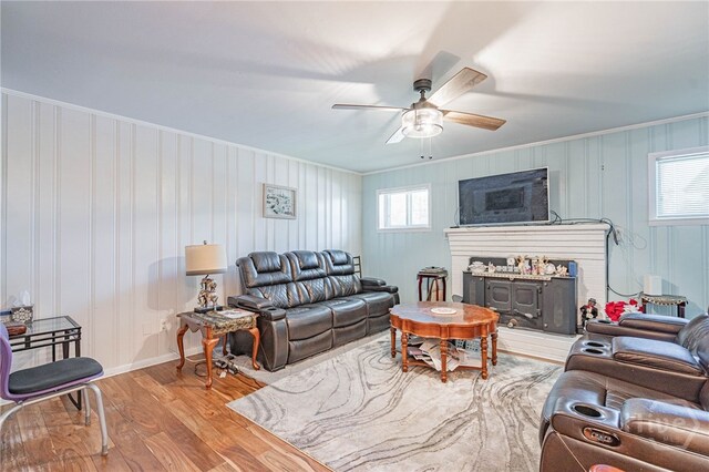 124 Drennon Dr, Jesup, GA 31545 - living room featuring wood finished floors, crown molding, a ceiling fan, and a fireplace