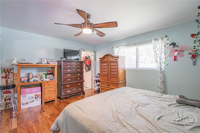 124 Drennon Dr, Jesup, GA 31545 - bedroom featuring wood finished floors, ceiling fan, a closet, and a walk in closet