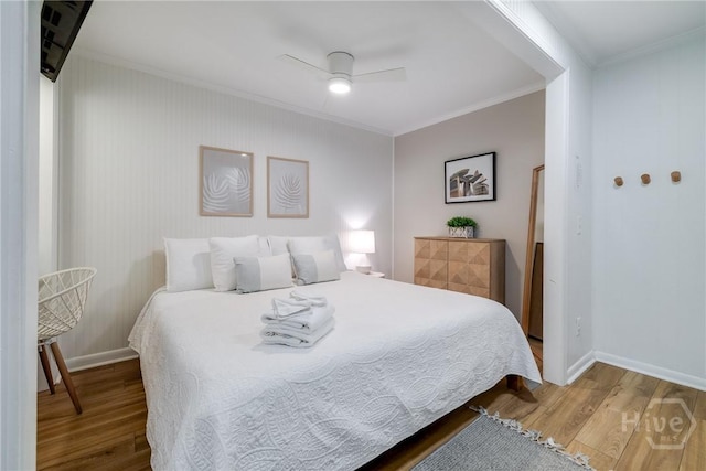 1217 Bay St Unit 109B, Tybee Island, GA 31328 - bedroom with crown molding, wood finished floors, and ceiling fan