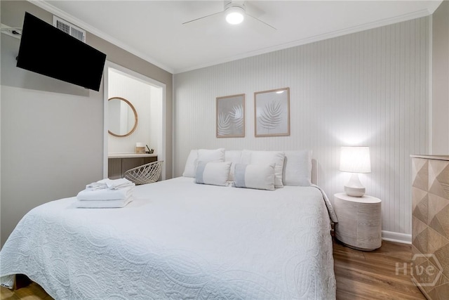 1217 Bay St Unit 109B, Tybee Island, GA 31328 - bedroom with wood finished floors, ornamental molding, and a ceiling fan