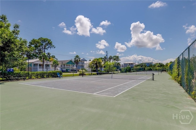 1217 Bay St Unit 109B, Tybee Island, GA 31328 - view of tennis court featuring community basketball court