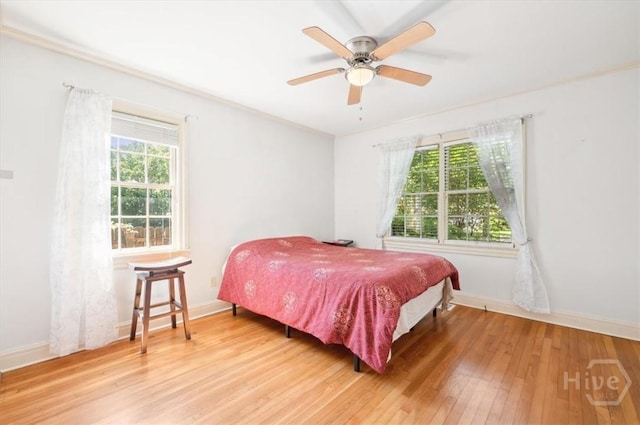 308 E 55th St, Savannah, GA 31405 - bedroom featuring multiple windows, wood-type flooring, and ceiling fan