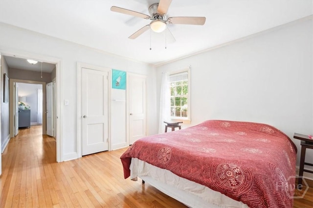 308 E 55th St, Savannah, GA 31405 - bedroom with light wood-style floors and ceiling fan