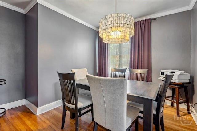 308 E 55th St, Savannah, GA 31405 - dining room with a chandelier, wood finished floors, and crown molding