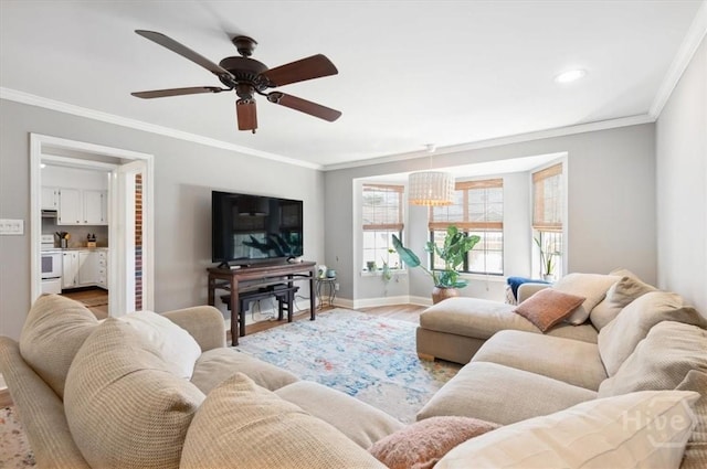 308 E 55th St, Savannah, GA 31405 - living room featuring light wood-type flooring, crown molding, ceiling fan, a chandelier, and recessed lighting