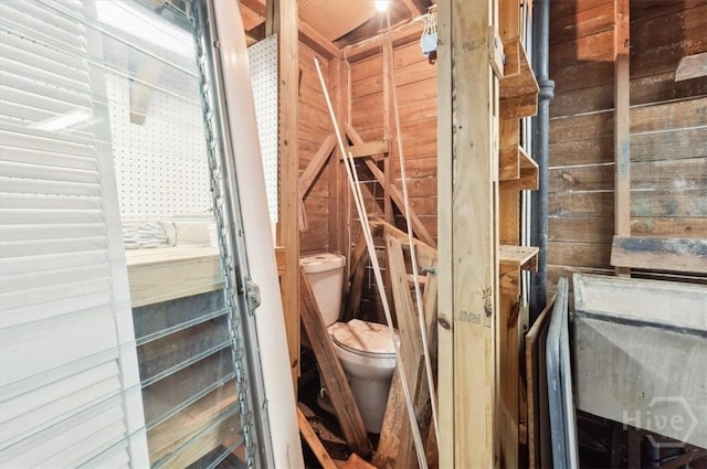 308 E 55th St, Savannah, GA 31405 - bathroom with toilet and wood walls