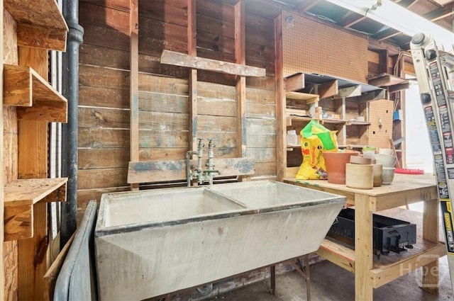308 E 55th St, Savannah, GA 31405 - miscellaneous room featuring concrete flooring and wood walls