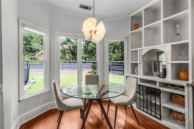 17 Hickory Grove Pt, Savannah, GA 31405 - dining space with wood finished floors, healthy amount of natural light, and crown molding