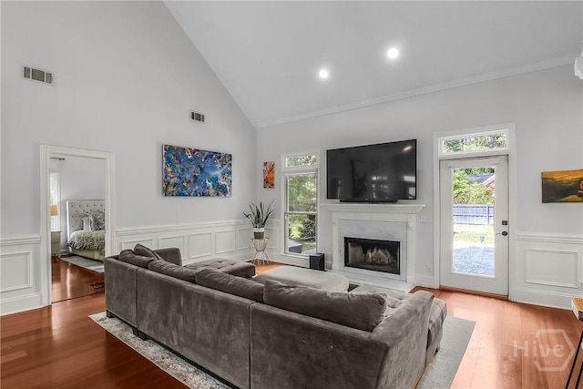 17 Hickory Grove Pt, Savannah, GA 31405 - living area with a high end fireplace, a wainscoted wall, wood finished floors, crown molding, and a decorative wall