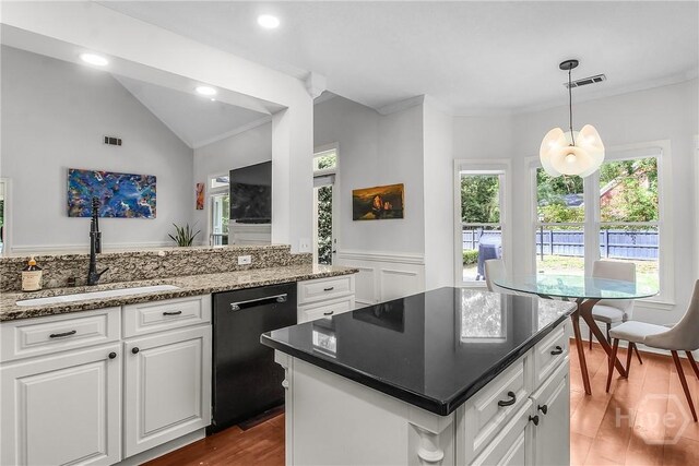 17 Hickory Grove Pt, Savannah, GA 31405 - kitchen featuring black dishwasher, plenty of natural light, wood finished floors, wainscoting, and crown molding