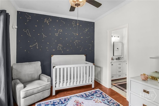 17 Hickory Grove Pt, Savannah, GA 31405 - bedroom with wood finished floors, crown molding, a nursery area, ensuite bathroom, and a ceiling fan