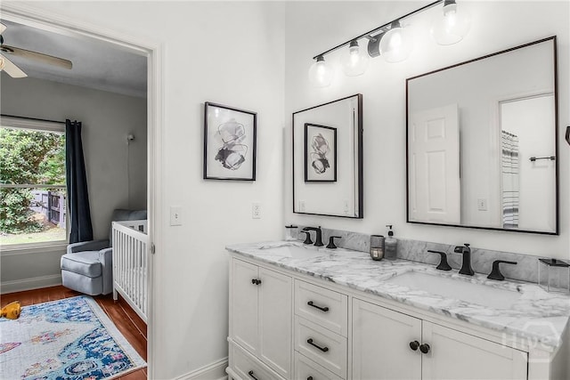 17 Hickory Grove Pt, Savannah, GA 31405 - bathroom featuring double vanity, wood finished floors, and a ceiling fan