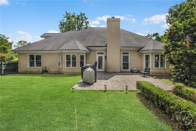 17 Hickory Grove Pt, Savannah, GA 31405 - back of house with a chimney, a patio area, stucco siding, and roof with shingles