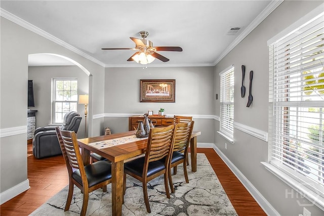 161 Laurel Ln, Guyton, GA 31312 - dining space with ceiling fan, arched walkways, wood finished floors, and ornamental molding