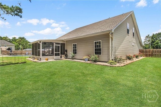 161 Laurel Ln, Guyton, GA 31312 - rear view of property with a sunroom, a fenced backyard, and a shingled roof