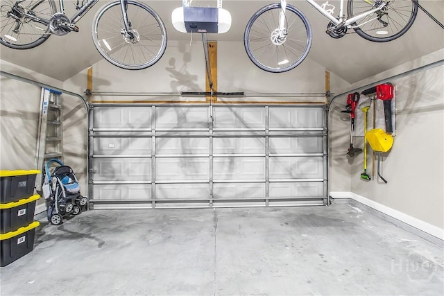 161 Laurel Ln, Guyton, GA 31312 - garage featuring a garage door opener and baseboards