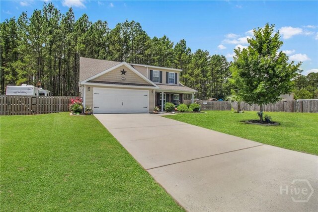161 Laurel Ln, Guyton, GA 31312 - traditional-style home with an attached garage and driveway