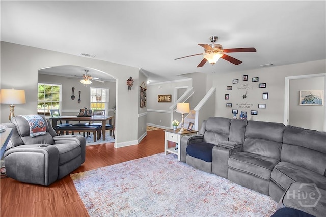 161 Laurel Ln, Guyton, GA 31312 - living room with a ceiling fan, arched walkways, and wood finished floors