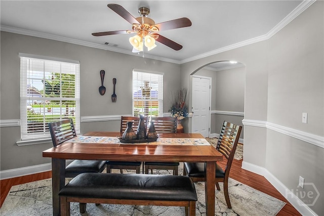 161 Laurel Ln, Guyton, GA 31312 - dining room featuring arched walkways, ornamental molding, wood finished floors, and a ceiling fan