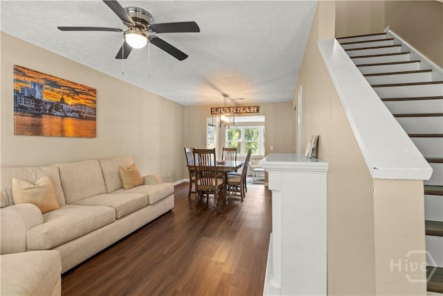 310 Mapmaker Ln, Savannah, GA 31410 - living room featuring dark wood finished floors, a textured ceiling, ceiling fan, and stairs