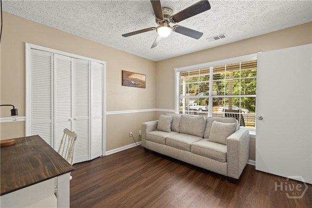 310 Mapmaker Ln, Savannah, GA 31410 - living room with dark wood finished floors, a textured ceiling, and ceiling fan