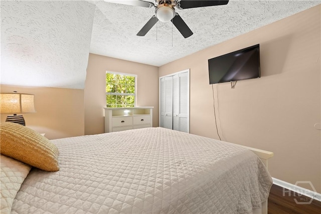 310 Mapmaker Ln, Savannah, GA 31410 - bedroom featuring wood finished floors, a textured ceiling, a closet, and a ceiling fan