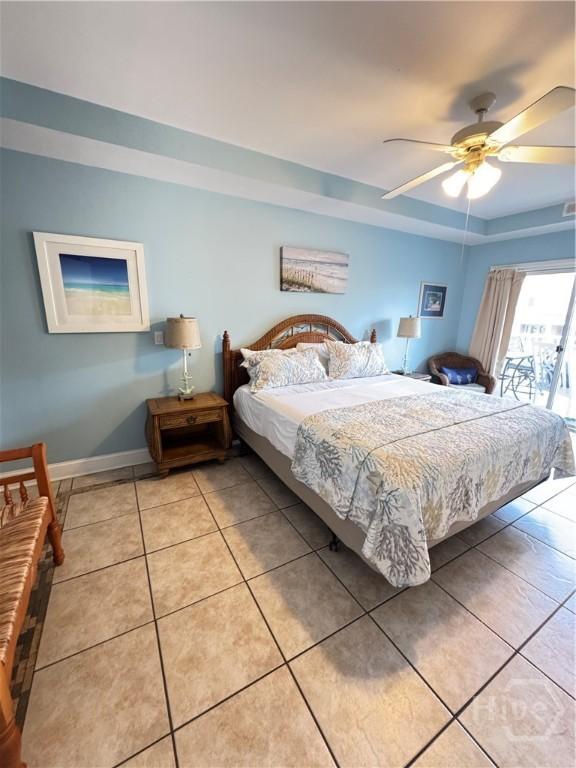 404 Butler Ave Unit 612, Tybee Island, GA 31328 - bedroom featuring light tile patterned floors, ceiling fan, and a raised ceiling