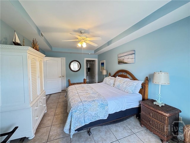 404 Butler Ave Unit 612, Tybee Island, GA 31328 - bedroom featuring light tile patterned floors, ceiling fan, and a raised ceiling