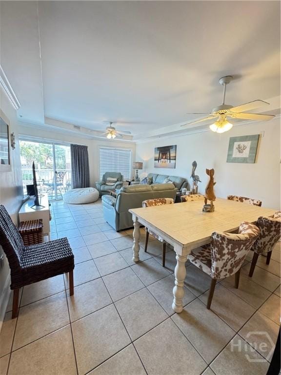 404 Butler Ave Unit 612, Tybee Island, GA 31328 - dining space featuring a ceiling fan, light tile patterned floors, ornamental molding, and a raised ceiling