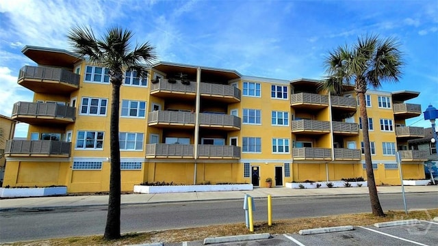 1609 Strand Ave Unit 306, Tybee Island, GA 31328 - view of apartment building / complex with uncovered parking